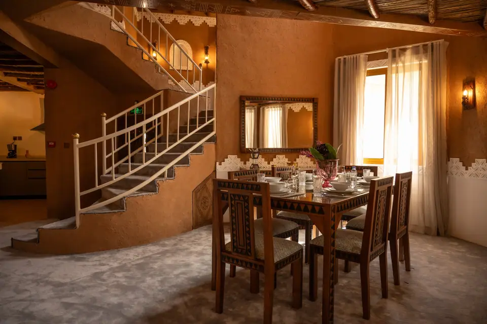Dining area and staircase inside a villa